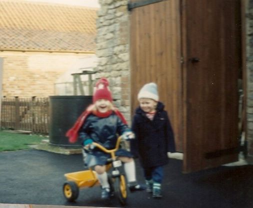 Me stealing my little brother's yellow tricycle